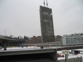 Precast concrete panel being lifted into place