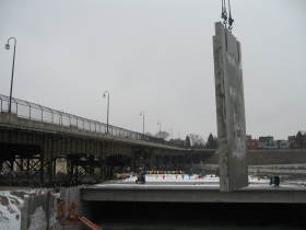 Precast concrete panel being lifted into place