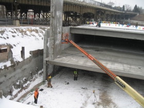 Precast concrete panel being lifted into place