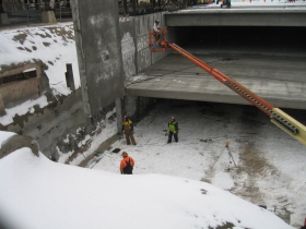 Precast concrete panel being lifted into place