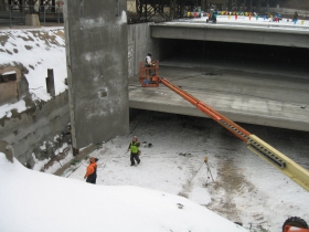 Precast concrete panel being lifted into place