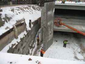 Precast concrete panel being lifted into place