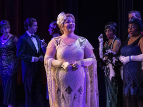 (Front) Kathryn Henry as Cinderella,  (Back Row) The Florentine Opera Chorus and Taylor-Alexis DuPont as Armelinde Pictordu (step-sister),  Zachary Crowle as Baron Pictordu (father) and Ardeen Pierre as Maguelonne Pictordu (step-sister)