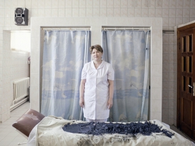 Sanatorium worker prepares to remove the rest of used healing mud. The mud reserves are coming to the end as a source mud lake is now placed on the territory of Kashagan oil refinery plant. Atyrau, Kazakhstan. 2012