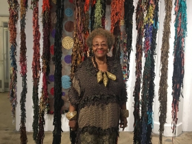 Rosemary Ollison: The artist in front of some of her leather works