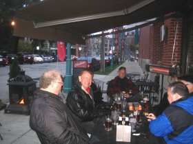 Jim Wiechmann and his real estate buddies gather on a Saturday afternoon outside Charlie's to drink and smoke cigars.