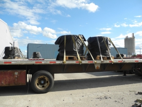Wire coils (which are often shipped from Europe) strapped to a flatbed