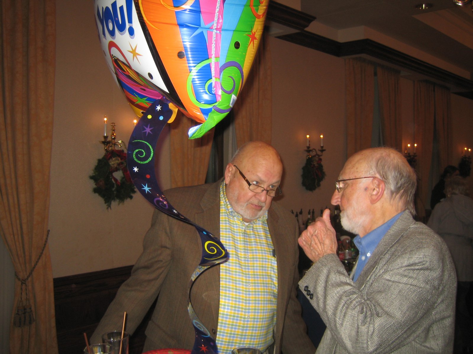 Rep. Fred Kessler (l) talks with Rev. Joseph Ellwanger.