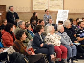 The City Hall Rotunda was packed with UWM urban studies students and professors, community organizers, city employees and homeowners.