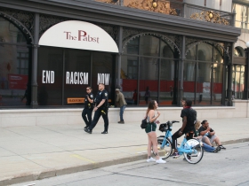 Police Walk By Defund the Police Mural