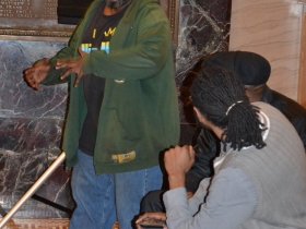 Poet Mario Willis performs most of his poem from the audience.
