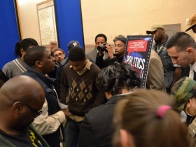 Poets and politicians take a moment to remember Anita Bee before the event begins.