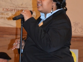 Alderwoman Coggs welcomes the audience.