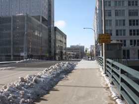 A bridge over the river at Michigan Street brought development