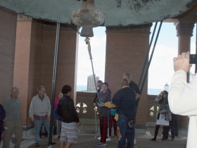 Preparing to ring the bell.