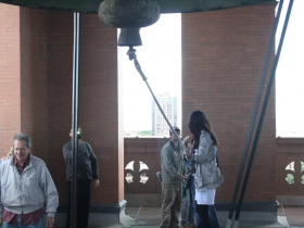 Preparing to ring the bell.
