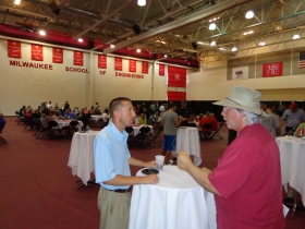 County Supervisor Steve Taylor of Franklin chats with an MSOE professor at the grand opening of the MSOE Athletic Field and Parking Complex.