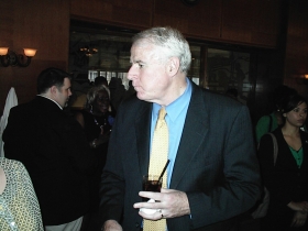 Mayor Barrett looks around at the Gwen Moore birthday party.