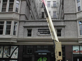 Window washers use a lift to make their job easier, faster and safer in the Colby Abbot Building, the headquarters of Urban Milwaukee and Urban Milwaukee: The Store.
