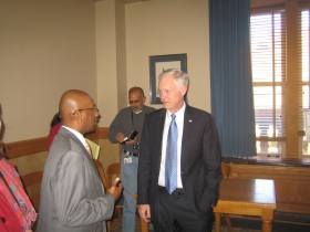 Ald. Joe Davis chats with US Sen. Ron Johnson.