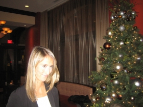 Grace Fuhr beside the Christmas tree at the Hilton Garden Inn downtown at her farewell party from Historic Milwaukee, Inc. Friday, January 3rd, 2013.