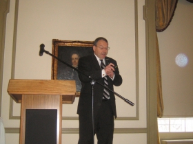Milwaukee Commissioner of the Department of City Development Rocky Marcoux fiddles with the flicker as he gives a whirlwhind slide tour of recent downtown development [Photograph taken Monday, January 13th, 2014 by Michael Horne.]