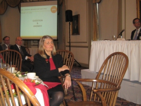 Greater Milwaukee Committee Executive Director Julia Taylor prepares for the question-and-answer round at her group's meeting on Downtown Development at the University Club. [Photograph taken Monday, January 13th, 2014 by Michael Horne.]