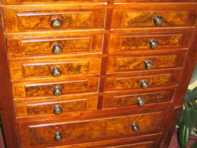 This remarkable clerk's cabinet with burled Walnut veneer drawer fronts sits in the office of the Common Council President. It very likely predates City Hall. The drawers were made with hand tools, and were not machine-made.