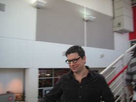 Kyle Cherek, the host of Wisconsin Foodie, dashing down the stairs.