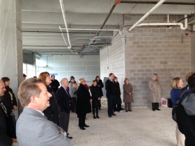 The crowd listens to the announcement.