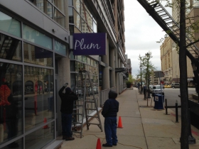 The sign going up at Plum