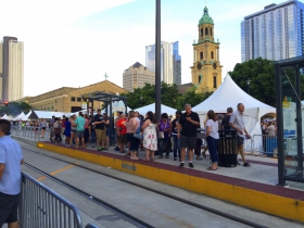 People wait to ride The Hop at Bastille Days