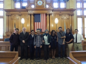 Youth Council members lead Egyptian students on a tour of the Common Council chamber in City Hall.