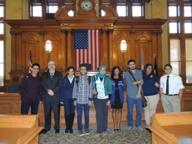 City Clerk Jim Owczarski and Milwaukee Youth Council Members pose with Egyptian students during a tour of the Common Council chamber.
