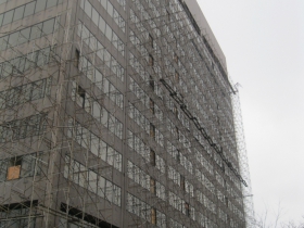Scaffolding wraps the building.