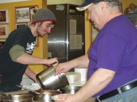 “Spanky” and James Stocks work together at the steam table.  Photo by Peggy Schulz.