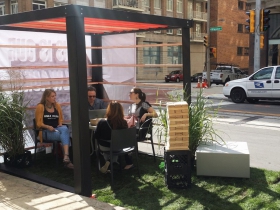 People sit at the Rinka Chung Architecture parklet
