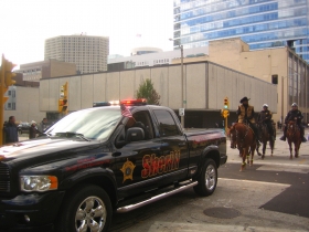 Sheriff David A. Clarke Jr., as usual, rides on his horse sporting a cowboy hat in the parade.