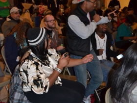 Some of the night's young poets dance to the musical styles of DJ Sherman