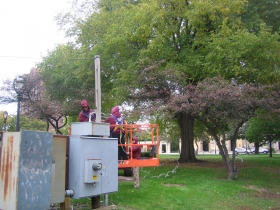 Holiday lights going up in Cathedral Square.