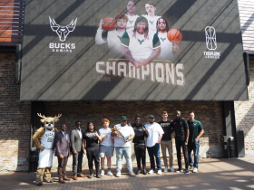 Bucks Gaming Poses With Trophy