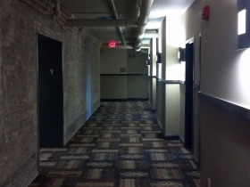 Brick, steel, copper, and wood are left exposed.