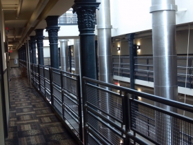 The carpeting around the atrium in The Brewhouse Inn & Suites.