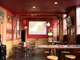 Back of the bar with projection screen.