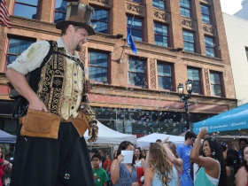 Bubble blowing stilt walker from Pantaloons Productions