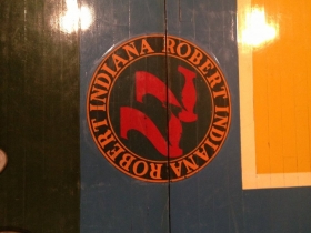 Robert Indiana's signature on the MECCA floor.
