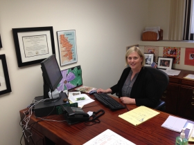 Executive director Dawn Caldart sits at her desk at the Milwaukee Justice Center.