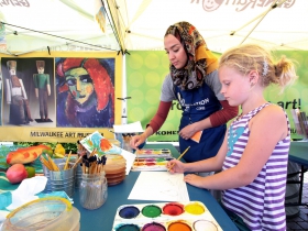 The Kohl's Color Wheels tent, Team Coordinator Liala Amin, and Lucy Klassen, from Milwaukee