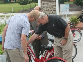 Barry Mainwood helps Tom Barrett unlock a bike.