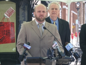 Ald. Nik Kovac speaking at the ZipCar event.